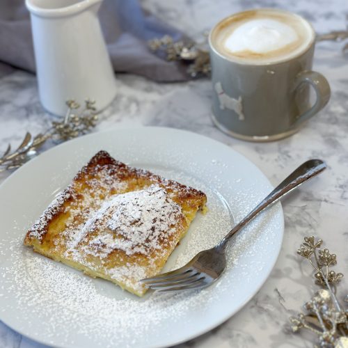 Image of a slice of german pancake served on a plate