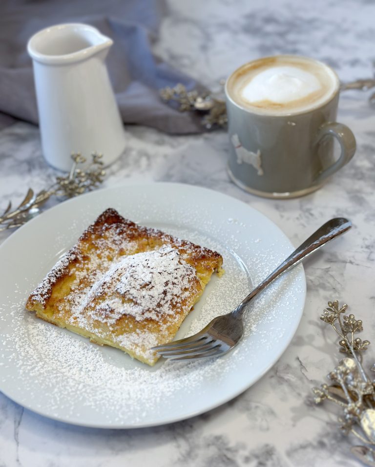 Image of a slice of german pancake served on a plate