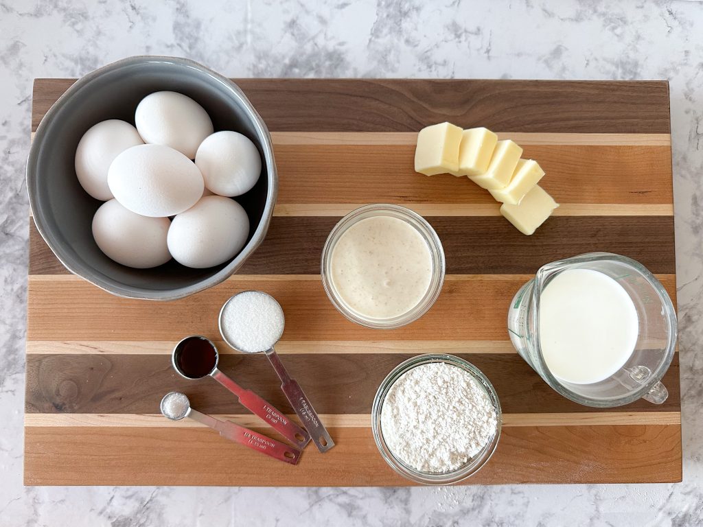Image of the ingredients: Eggs, flour, milk, discard, butter, sugar, vanilla extract, salt