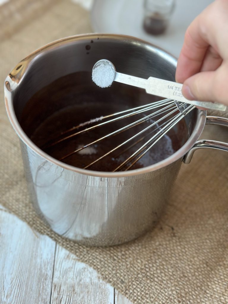 Picture of salt poured into pot
